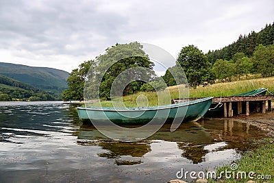 Rowing Boat Moored at a Scottish Loch Stock Photo