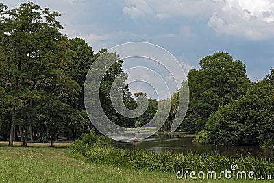 Rowing boats on the lake in the historic park Schoenbusch, Aschaffenburg, Germany Editorial Stock Photo