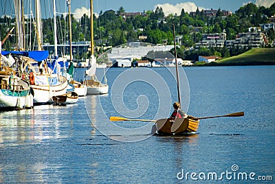 Rowing a Classic Wood Boat Stock Photo