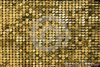 Rows of blinking golden yellow brass metal plaques sway in wind and shines in sun and create unique pattern of movement. round Stock Photo