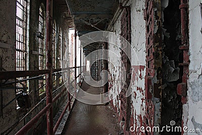 Rows of Cell Doors Inside Abandoned Prison Stock Photo