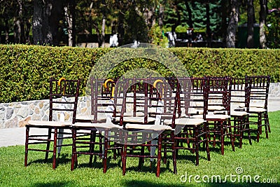 Rows of chairs for guests at an open-air wedding ceremony Stock Photo