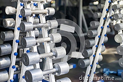 Rows of dumbbells in the gym. Dumbbell set. Close up many metal dumbbells on rack in sport fitness center Stock Photo