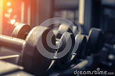 Rows of dumbbells in the gym with hign contrast and monochrome c Stock Photo