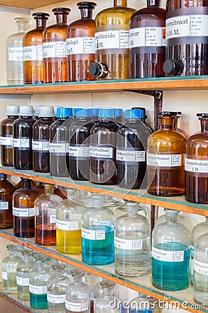 Rows of fluid chemicals in bottles at chemistry education Stock Photo