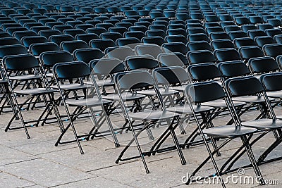 Rows of folding chairs, empty seats ion event - chair row Stock Photo