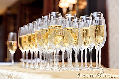 Rows of full champagne or sparkling wine glasses. Stock Photo