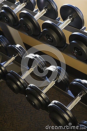 Rows of Hand Weights on Rack Stock Photo