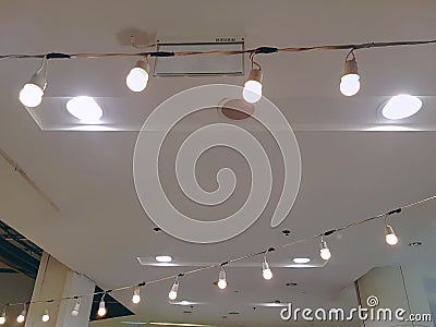 Rows of Illuminated Lamps Against Ceiling Stock Photo