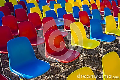 Rows of modern colored chairs Stock Photo
