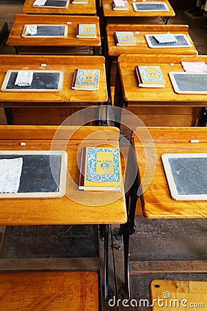 Rows of old school desks Stock Photo