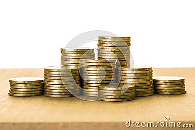 Rows of pile coins on table Stock Photo