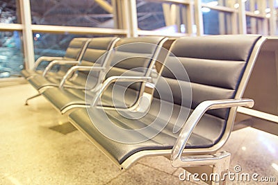 Rows of seats in airport lounge Stock Photo