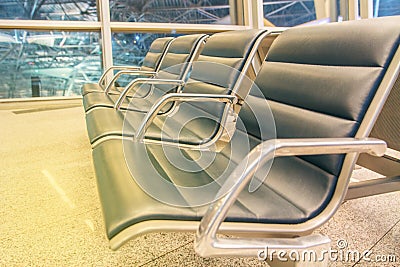 Rows of seats in airport lounge Stock Photo