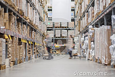 Rows of shelves with boxes in modern warehouse Stock Photo