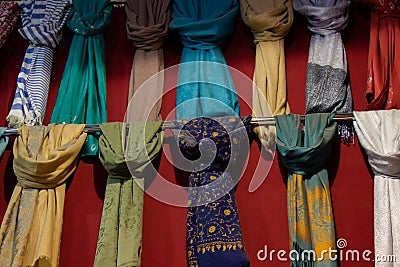 Rows of soft multi-colored pieces of fabric in a bazaar Stock Photo