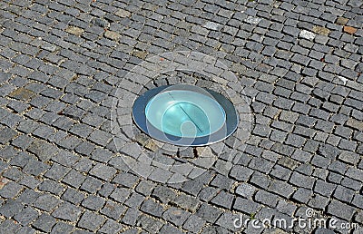 3 rows of stairs in the square are gradually sunk into the paving. Slow transition of the staircase to the plane by blending, inte Stock Photo