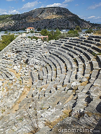 Rows of stone seats of ruins of Theatre in Letoon Ancient City in village Kumluova, Turkey. Sunny day, Greek culture Stock Photo
