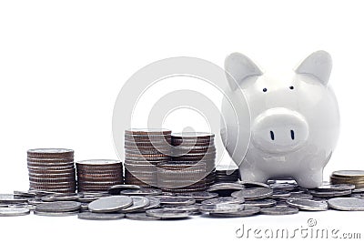Rows of Thai coins,Baht coins with piggy bank. Saving money Concept for financial, business, education and investment. Stock Photo