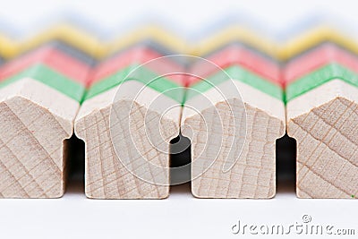 Tiny wooden toy houses painted in different colors Stock Photo