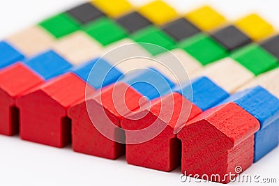 Tiny wooden toy houses painted in different colors Stock Photo