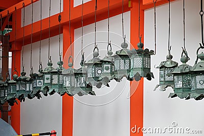 Rows of traditional bronze lanterns hanging in Kasuga Taisha Shrine Stock Photo