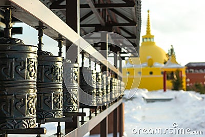 Traditional spinning prayer wheels at temple complex, asian culture of Hindu and Buddhist faith at local monastery Stock Photo