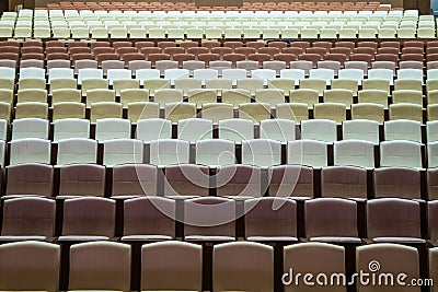 Rows of vacant spectators seats in theater. Abstract background Stock Photo