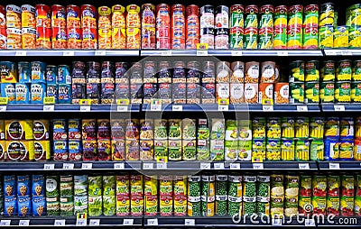 Rows of variety canned food product on shelves in a grocery store Editorial Stock Photo