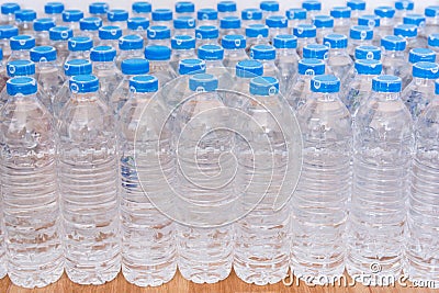 Rows of water plastic bottles and cap seal NSF us standard Editorial Stock Photo