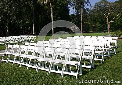 Rows of white chairs Stock Photo