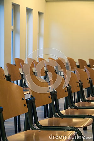 Rows of wooden chairs Stock Photo