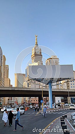 Royal Clock tower in Makkah, Saudi Arabia. Street view in Saudi Arabia. Flyover Bridge. People walking in the road. Editorial Stock Photo