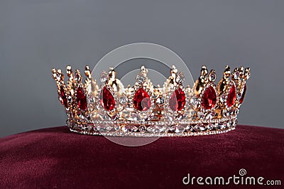 Royal crown with red gems. Ruby, garnet. Symbol of power and authority Stock Photo