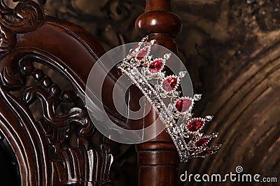 Royal crown with red gems. Ruby, garnet. Symbol of power and authority Stock Photo