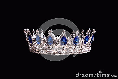 Royal crown with sapphire isolated on black background Stock Photo