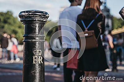 Royal cypher of HM the Queen Elizabeth II EIIR on a post outside Buckingham Palace, London, UK Editorial Stock Photo