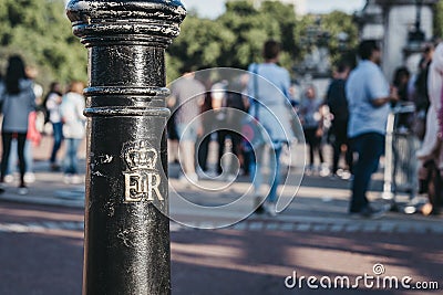 Royal cypher of HM the Queen Elizabeth II EIIR on a post outside Buckingham Palace, London, UK Editorial Stock Photo