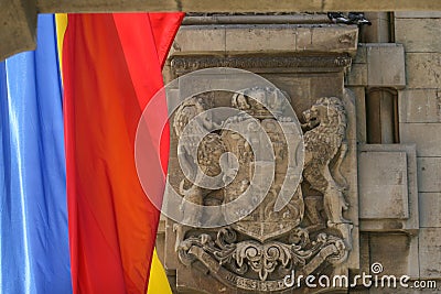 Royal emblem of Romania and Romanian flag Editorial Stock Photo