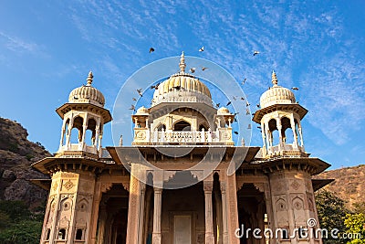 Royal Gaitore Tumbas in Jaipur India with bird flying over in blue sky. Stock Photo