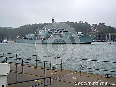 Royal Navy Frigate at anchor in river Editorial Stock Photo