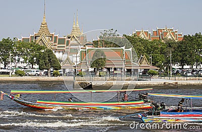 Royal Palace Bangkok and long tail riverboats Thailand Editorial Stock Photo