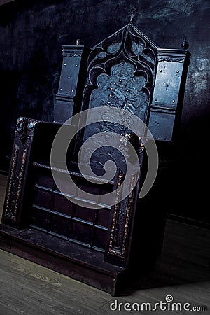 Royal throne. dark Gothic throne, side view Stock Photo