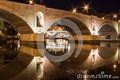 Roma, Bridge on Tiber River with Sant Angelo Castle at Night, with Lights and Reflections Stock Photo