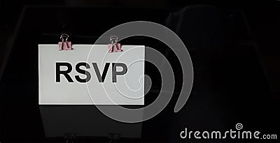 RSVP word written on white sticker Stock Photo