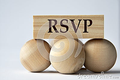 RSVP - words on a wooden block on a white background with wooden balls Stock Photo