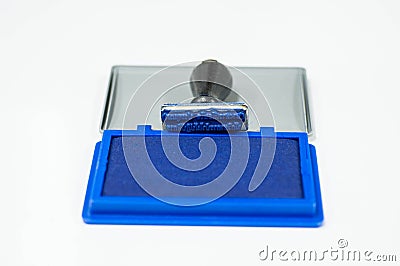 Rubber stamp and blue color inkpad Stock Photo