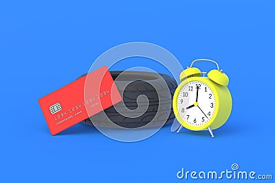 Rubber tyre near credit card and alarm clock. The cost of replacing car wheels Stock Photo