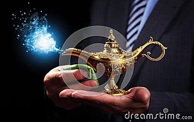 Rubbing magic Aladdins genie lamp Stock Photo