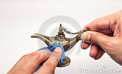 Rubbing magic lamp Stock Photo